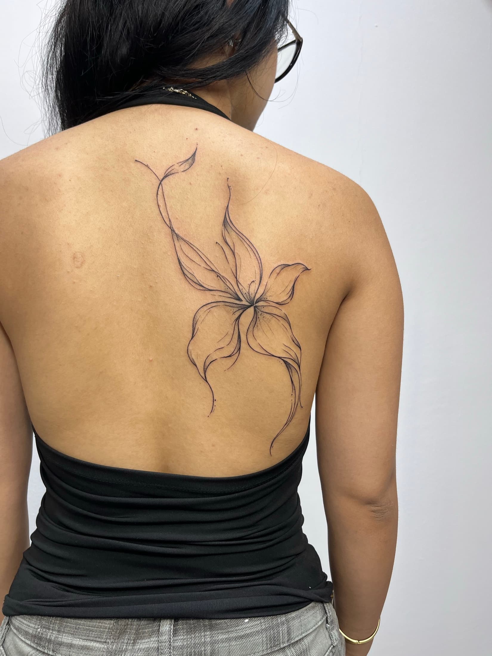 Large floral Fineline tattoo across the back